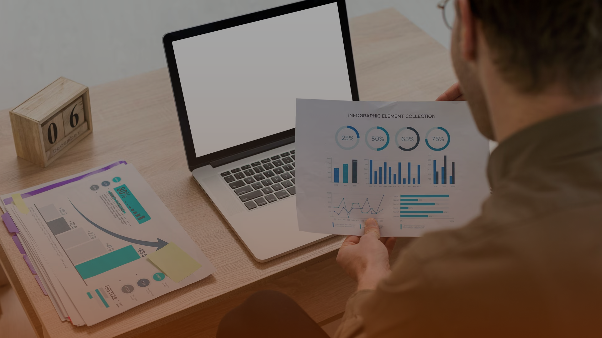 Professional reviewing predictive analytics reports to improve marketing strategy