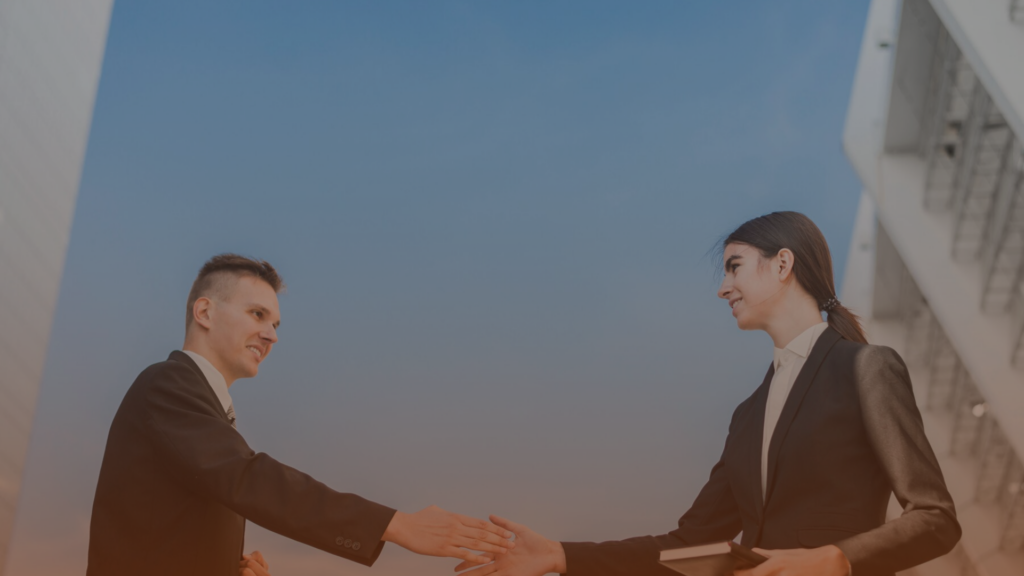Business professionals shaking hands to build a strategic partnership