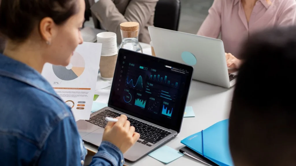 Marketing team reviewing budget allocation and campaign performance analytics
