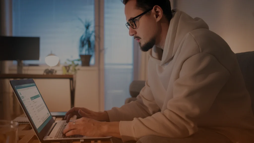 SEO professional working on a laptop representing an entry-level SEO package for Toronto businesses, including website optimization and search strategy services